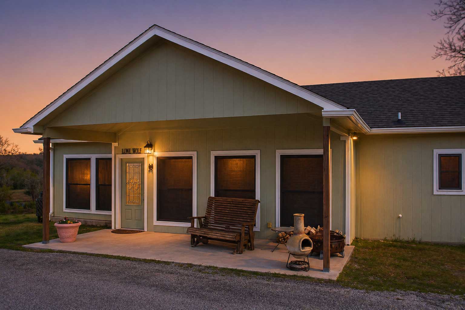 The Long Wolf Cabin at Willowood Ranch with warm lighting at sunset