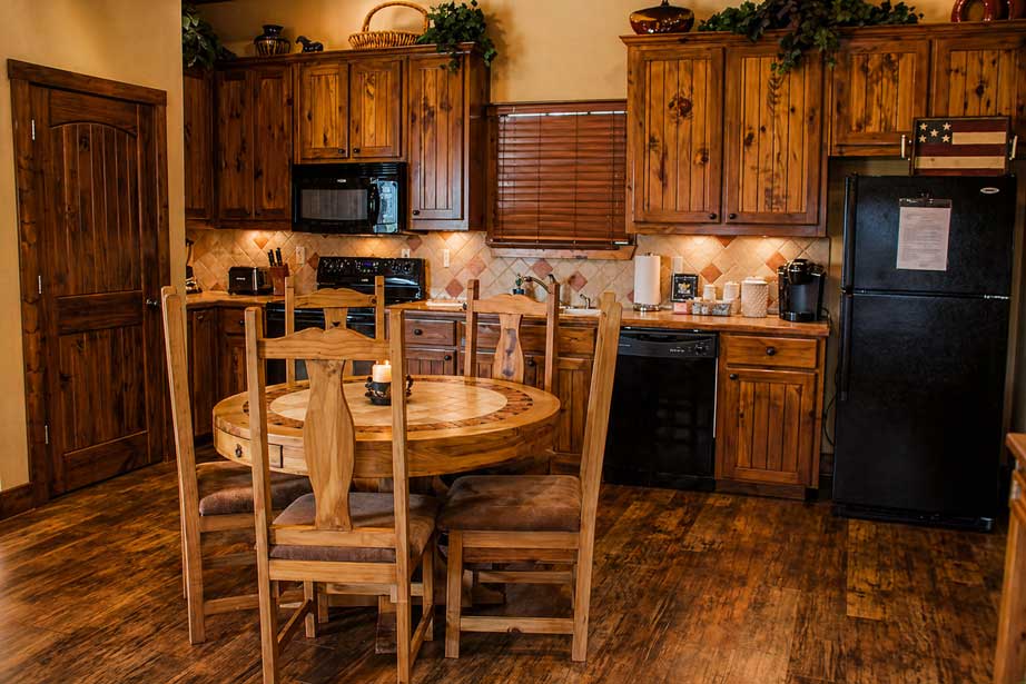 Fully equipped kitchen and dining area inside Willowood Ranch lodge