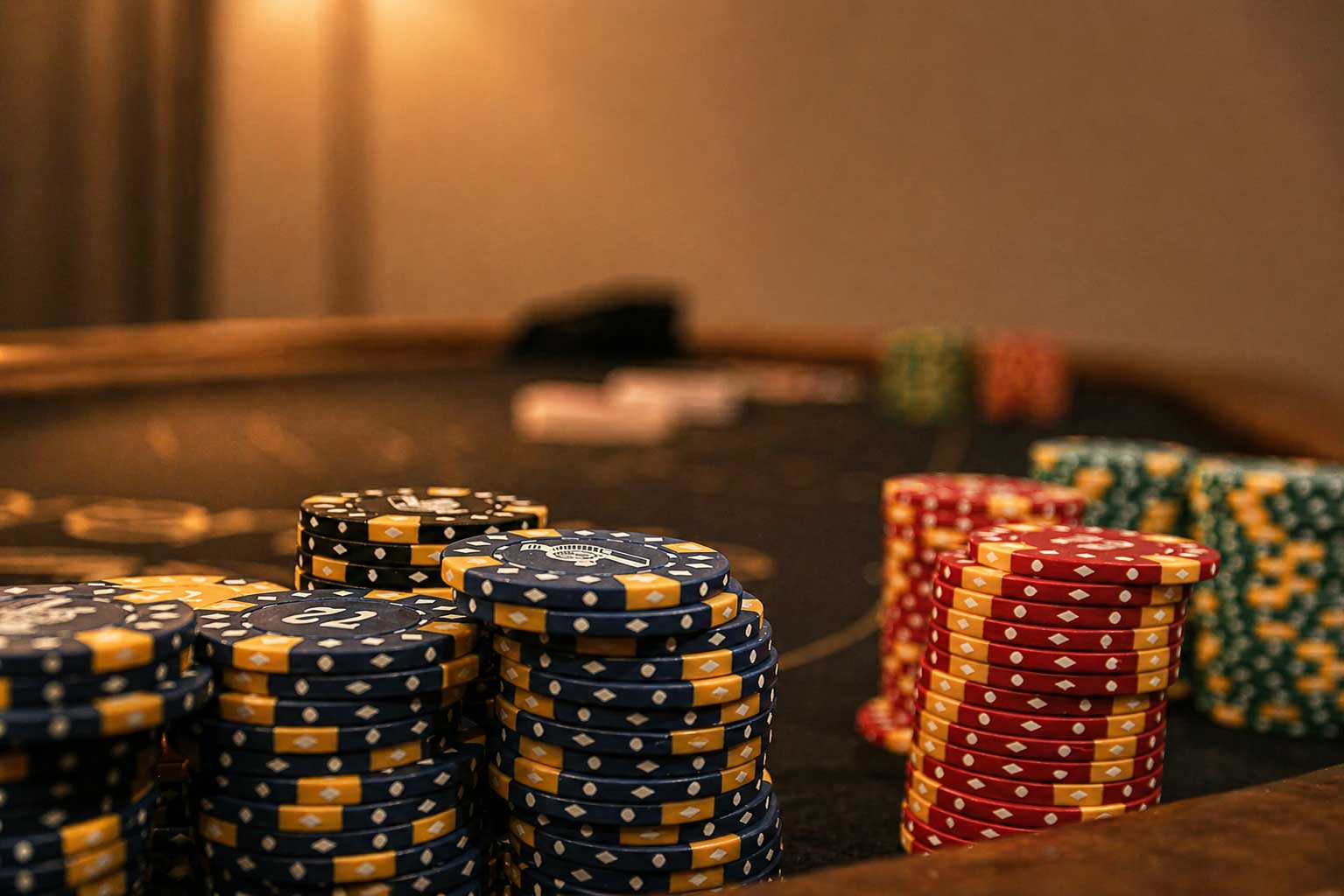Poker table with stacked chips in the Willowood Ranch lodge game room