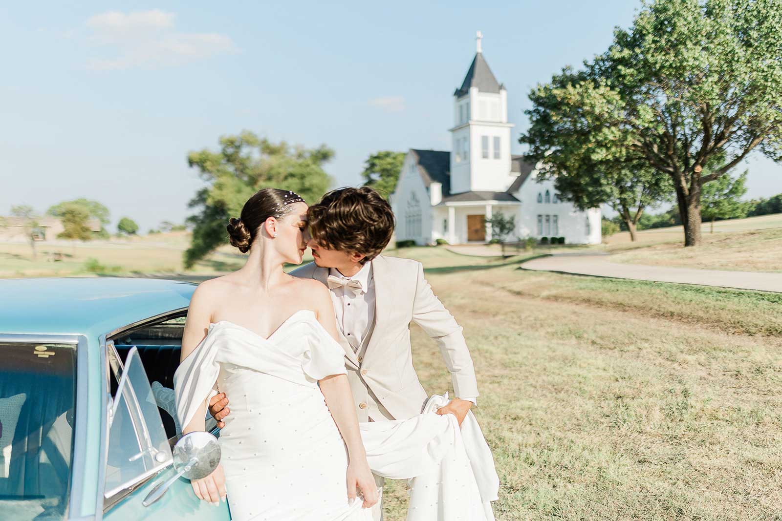 Bride and groom taking wedding photos on Willowood Ranch grounds with chapel in background in Bells Texas near Dallas